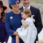 Kate wore a knee length Jenny Packham blue dress with a matching Locke & Co hat and the Queen’s Maple Leaf brooch a she held on to Princess Charlotte © Atlantic Images Royal Tour Canada Prince William Kate Middleton Prince George Princess Charlotte Jenny Packham Dress