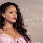 Rihanna hit a red carpet in Madrid, Spain wearing an off-the-shoulder cleavage-baring dress by Ukrainian designer Marianna Senchina - Photos courtesy of Sephora / Image.net / Atlantic Images Rihanna Fenty Beauty Launch Tattoos Cleavage Marianna Senchina Dress Madrid Spain Olgana Paris shoes Chopard jewelry