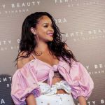 Rihanna hit a red carpet in Madrid, Spain wearing an off-the-shoulder cleavage-baring dress by Ukrainian designer Marianna Senchina - Photos courtesy of Sephora / Image.net / Atlantic Images Rihanna Fenty Beauty Launch Tattoos Cleavage Marianna Senchina Dress Madrid Spain Olgana Paris shoes Chopard jewelry